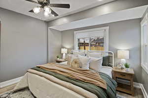 Bedroom featuring light wood-type flooring and ceiling fan