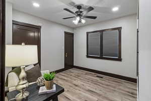 Foyer entrance with light wood finished floors, recessed lighting, and ceiling fan