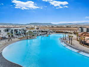Swimming pool featuring a mountain view and a patio area