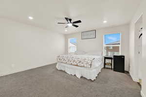 Bedroom featuring carpet floors, a ceiling fan, and recessed lighting