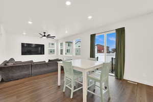 Dining space with recessed lighting, dark wood-type flooring, and ceiling fan