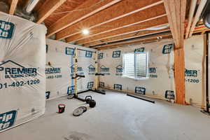 Workout room featuring concrete floors