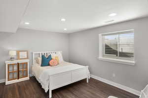 Bedroom featuring recessed lighting and dark wood finished floors