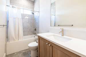 Bathroom featuring vanity and shower / bath combo