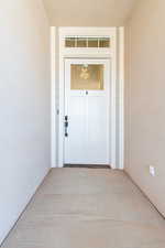 Property entrance with stucco siding