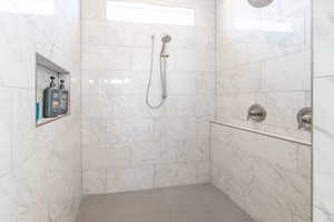 Full bathroom with tiled shower