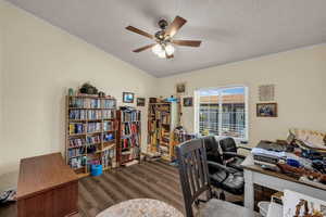 Office with dark wood-style flooring, a textured ceiling, and ceiling fan