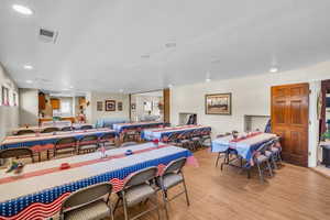 Dining space featuring light wood-style flooring and recessed lighting