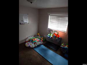 Playroom with carpet flooring and baseboards