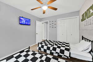 Bedroom with a closet and a ceiling fan