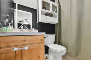 Bathroom with vanity and a shower with curtain