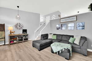 Living area with light wood-style floors