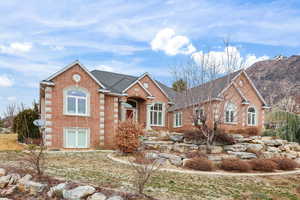 View of front of home featuring brick siding
