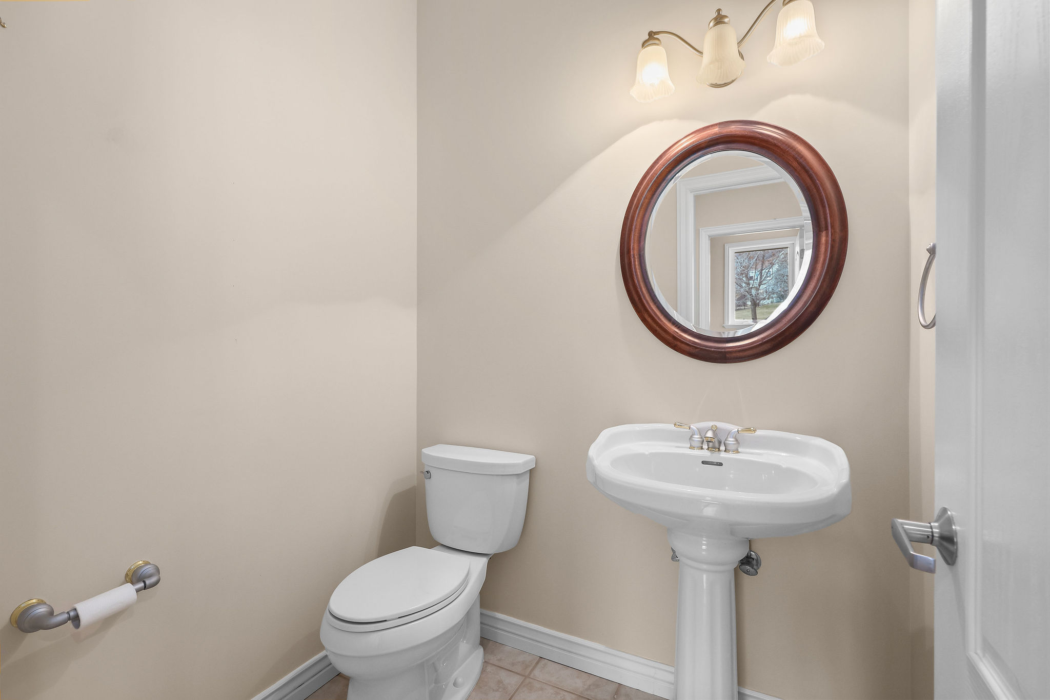 Bathroom featuring toilet and light tile patterned floors
