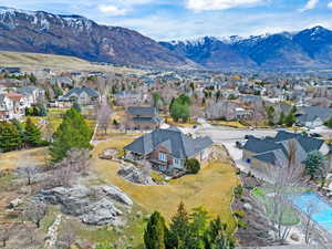 Aerial perspective of suburban area featuring a mountainous background