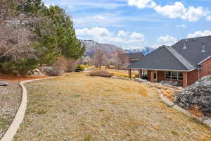 View of yard with a mountain view and a patio area