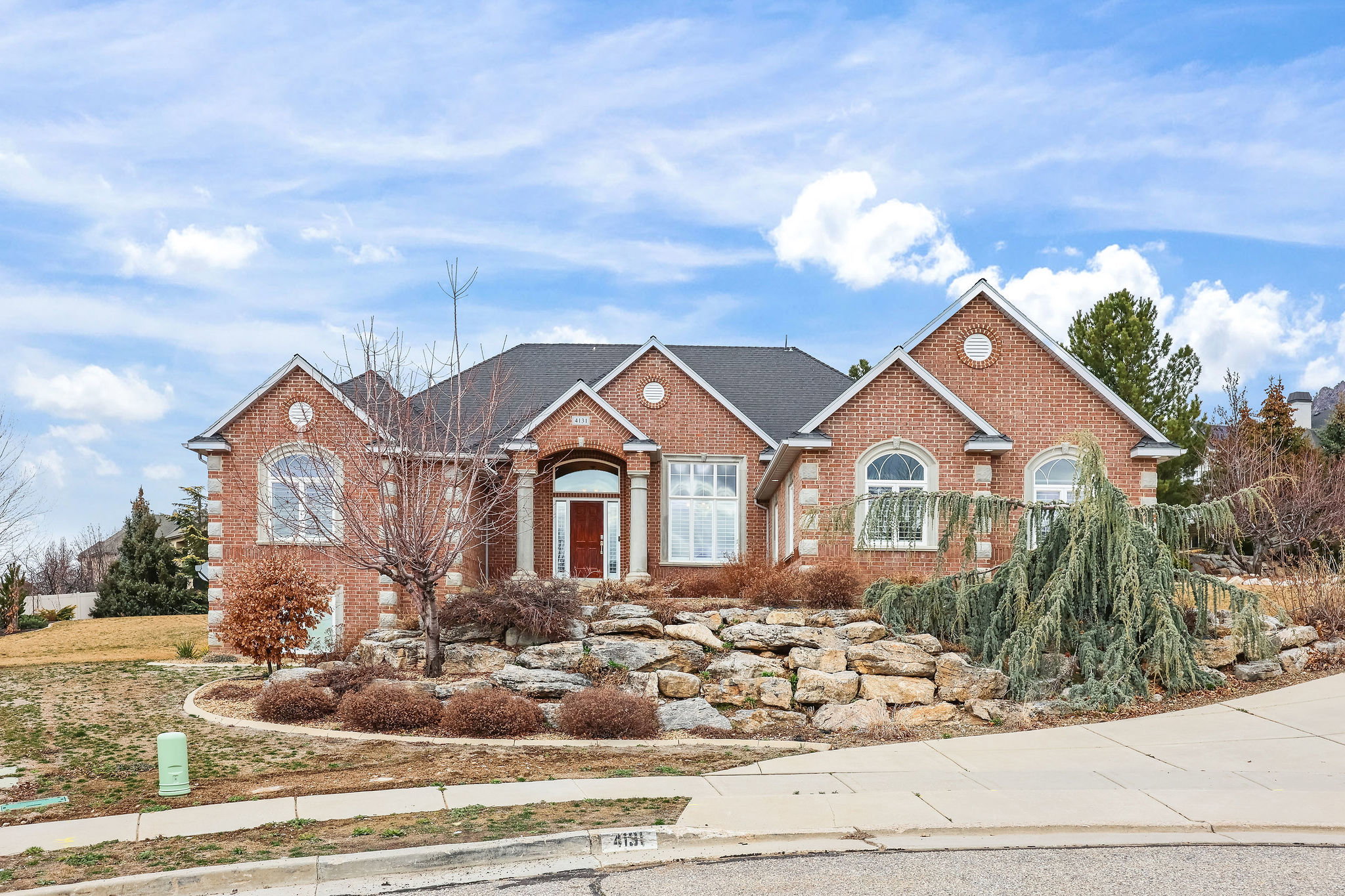 View of front facade featuring brick siding