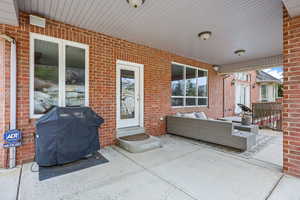 View of patio featuring grilling area and an outdoor living space