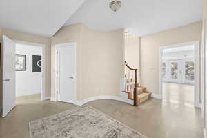 Interior space with finished concrete floors and baseboards