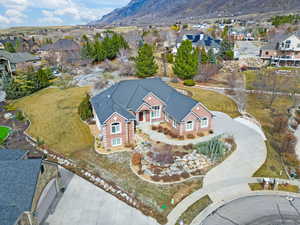 Aerial view of residential area featuring a mountainous background