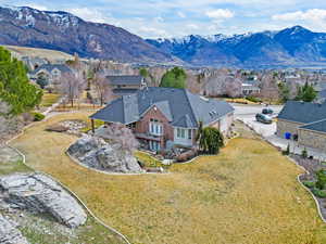 Aerial perspective of suburban area featuring a mountainous background