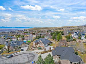Aerial perspective of suburban area with a mountain backdrop