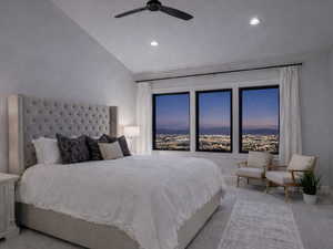 Bedroom with vaulted ceiling and a ceiling fan