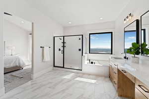 Full bathroom featuring a bath, a shower stall, ensuite bathroom, vanity, and recessed lighting