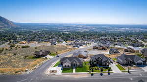 Aerial perspective of suburban area with a mountain backdrop