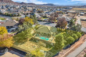 Aerial view of residential area featuring a mountain backdrop