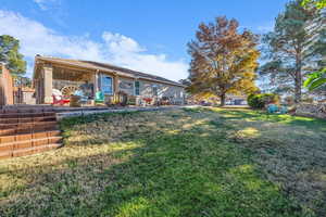 Rear view of property featuring a patio area