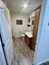Bathroom with vanity and stone finish floors