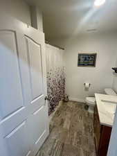 Bathroom featuring vanity and a shower with shower curtain