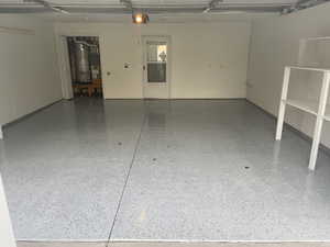 Garage featuring secured water heater