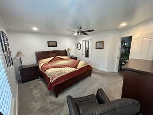 Bedroom featuring carpet flooring, ceiling fan, ornamental molding, and recessed lighting