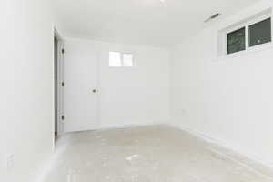 Spare room with concrete floors