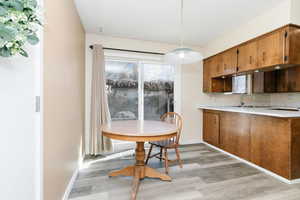 Dining space featuring light wood-style floors and plenty of natural light