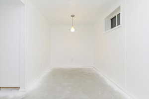 Unfurnished dining area with concrete floors