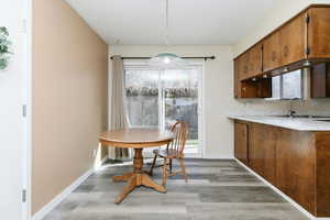 Dining area featuring light wood finished floors and plenty of natural light