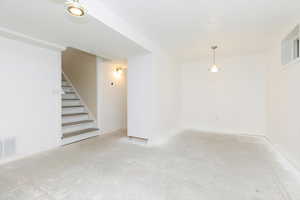 Finished basement with stairway