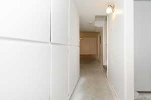 Hall featuring concrete flooring