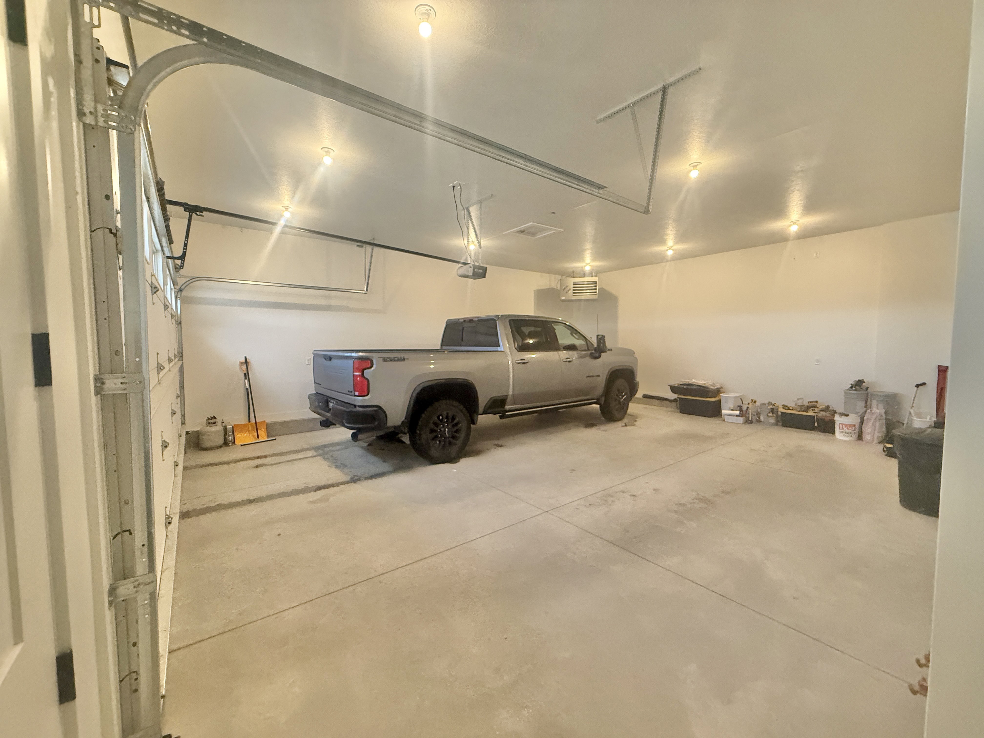 Garage featuring a heating unit