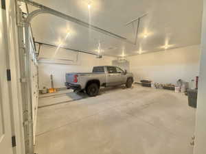 Garage featuring a heating unit