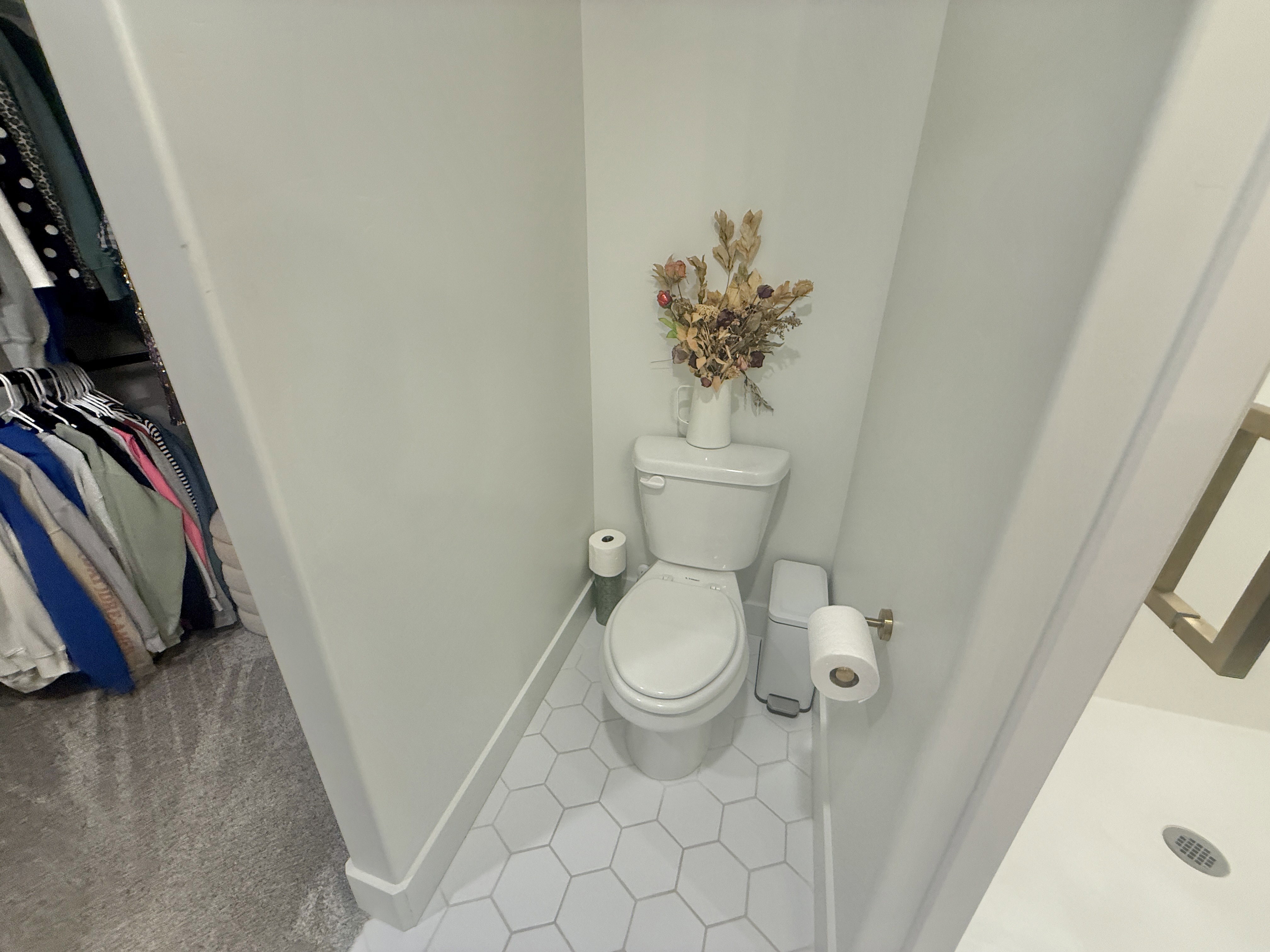 Bathroom with toilet and light tile patterned floors