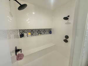 Bathroom featuring tiled shower