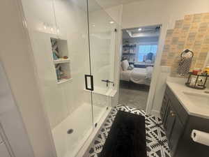 Ensuite bathroom with vanity and a stall shower