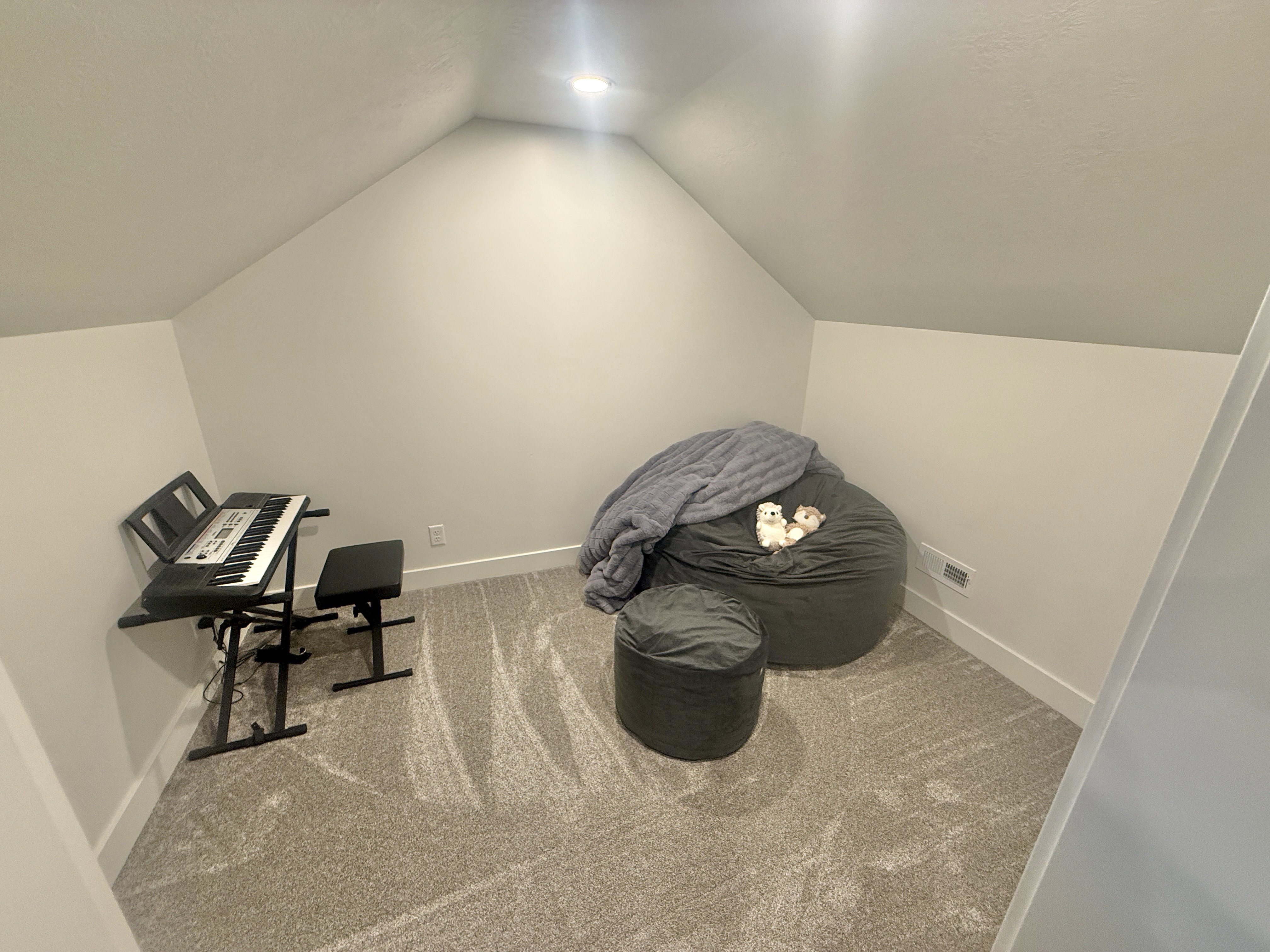 Additional living space with carpet flooring and baseboards