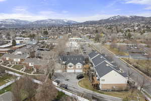 Aerial perspective of suburban area featuring a mountain backdrop