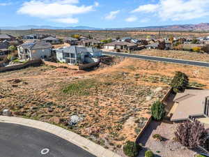 Aerial perspective of suburban area featuring a mountainous background