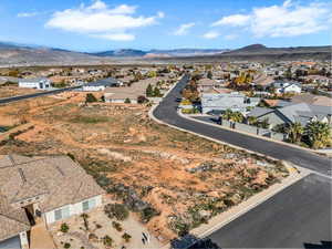 Aerial perspective of suburban area featuring a mountain backdrop